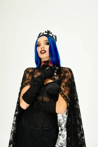 A beautiful young woman showcases her Halloween costume, exuding elegance and mystery with her look. — Stock Photo