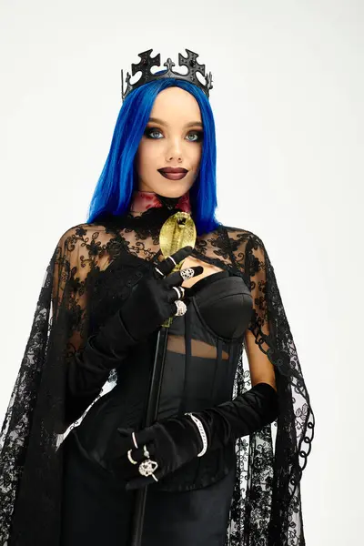 A stylish young woman showcases her enchanting Halloween costume, exuding elegance and mystery. — Stock Photo