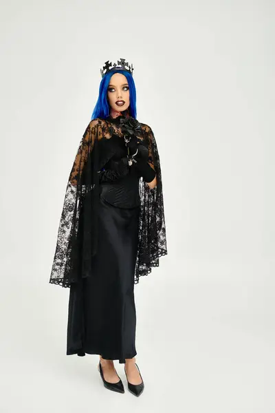 A young, beautiful woman showcases her Halloween costume with elegance and style. — Stock Photo
