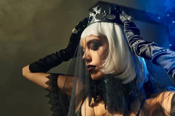 A graceful young woman stuns in a striking Halloween costume at a lively celebration. — Stock Photo