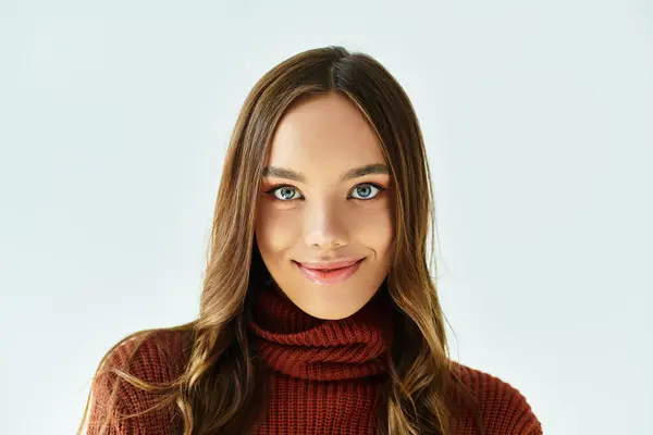 Cheerful woman dressed in elegant attire posing on white backdrop. — Stock Photo