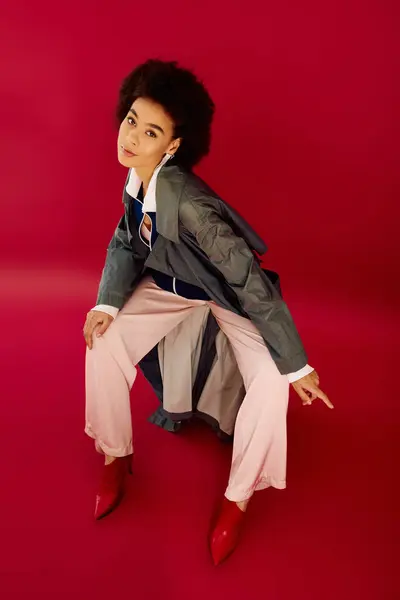 The young woman expresses deep emotion while showcasing trendy clothing and striking poses. — Stock Photo