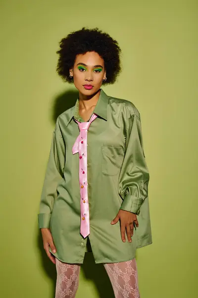 A young woman showcases her emotional spirit through vibrant colors and unique fashion choices. — Stock Photo