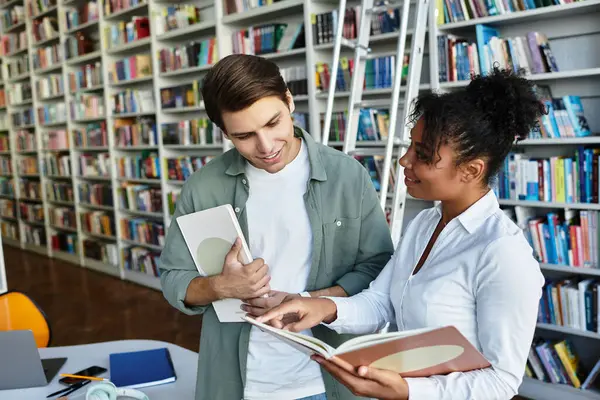 A dedicated teacher engages her student in an enriching learning experience surrounded by books. — Stock Photo