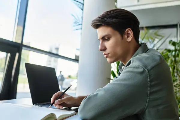 A thoughtful student learning in a vibrant classroom setting. — Stock Photo