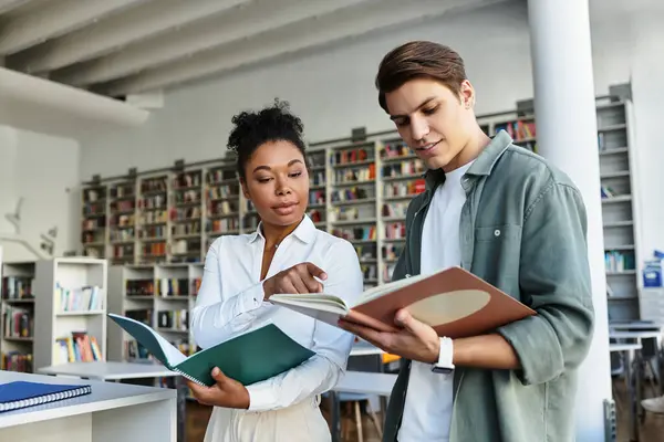 A passionate educator guides her curious student through engaging learning materials. — Stock Photo