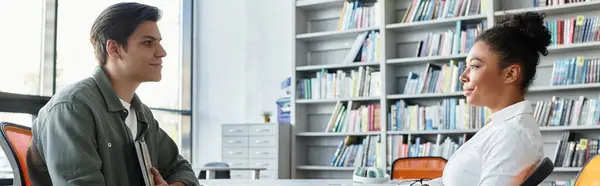 A dedicated teacher shares knowledge with her attentive young student in a cozy study space. — Stock Photo