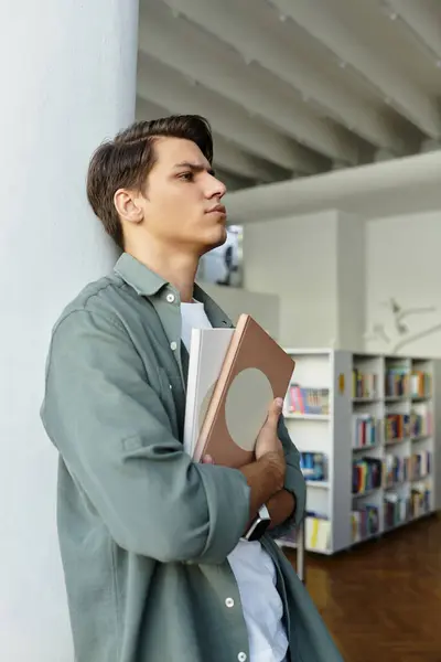 Devoted handsome student in casual attire at school, studying hard. — Stock Photo