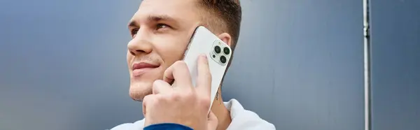 A young man engages in a phone conversation, proudly displaying his prosthetic leg. — Stock Photo