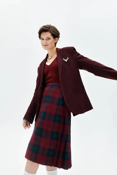 A stylish woman poses in a cozy winter outfit, exuding warmth and elegance. — Stock Photo
