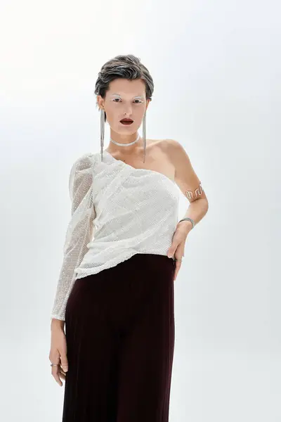 A stunning woman exudes charm in cozy winter wear, highlighting seasonal style with grace. — Stock Photo