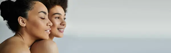 Two women share a joyful moment, glowing with happiness in a peaceful setting. — Stock Photo