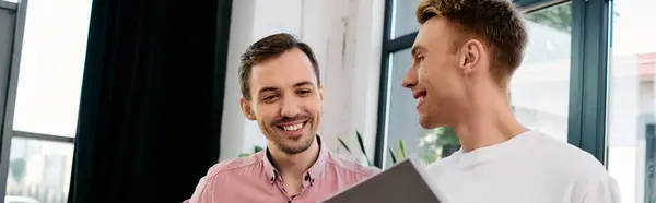 The couple shares laughter and conversation while enjoying their time in a cozy office. — Stock Photo