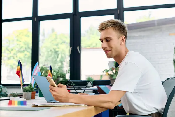 Merry blonde man in casual attire working in office. — Stock Photo