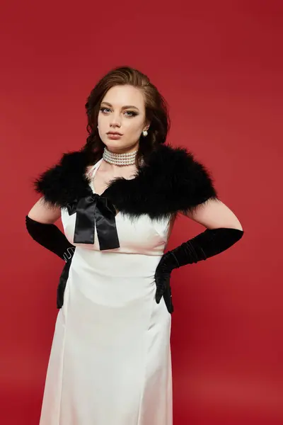A captivating young woman showcases her elegance in a luxurious outfit, radiating sophistication. — Stock Photo