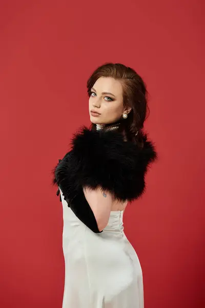 A young, beautiful woman models exquisite attire with confidence, creating an elegant atmosphere. — Stock Photo