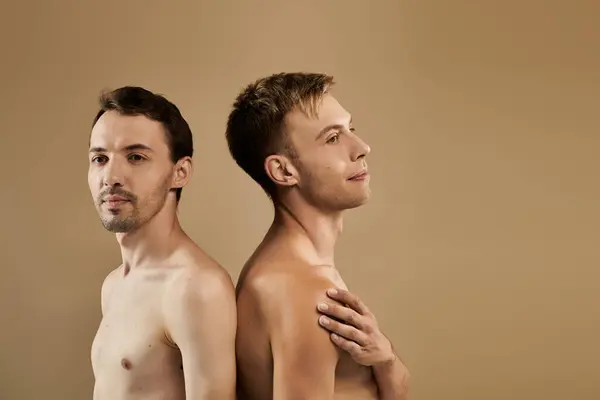 A young gay couple shares an intimate moment, displaying their trust and affection for each other. — Stock Photo