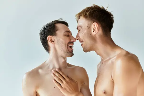 Two young men share a joyful and intimate moment, showcasing their love and happiness together. — Stock Photo