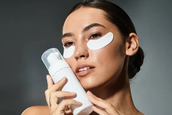 The woman enjoys a calming skincare routine while pampering her skin with care. — Stock Photo
