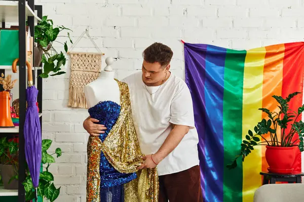 A person expresses creativity by draping sequined fabric over a mannequin in a vibrant workspace. — Stock Photo