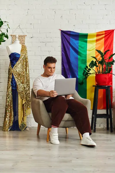 A unique individual works on a laptop in a cozy, colorful space that inspires creativity. — Stock Photo