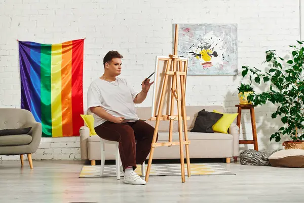 In a cozy studio, a queer artist creates amid vibrant decor. — Stock Photo
