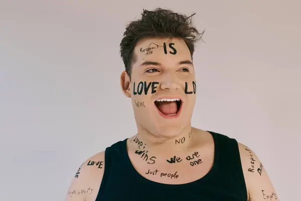 With a cheerful smile, a unique person showcases body art celebrating love and unity. — Stock Photo