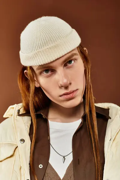 A teenage boy with striking red hair showcases his fashionable style in a dynamic studio atmosphere. — Stock Photo