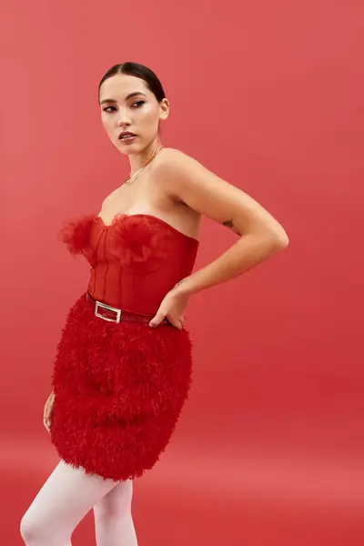 This stunning woman showcases her style and elegance in a bold red outfit that captivates attention. — Stock Photo