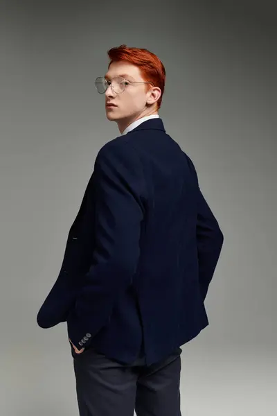 A young student with vibrant red hair poses confidently in a sophisticated winter outfit. — Stock Photo