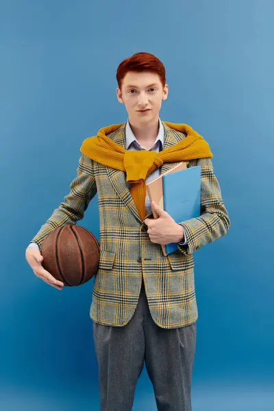 The young student showcases a vibrant layered winter outfit with confident poise in a fashion studio. — Stock Photo