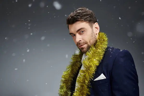 A stylish young man showcases his charm while dressed for a winter celebration. — Stock Photo