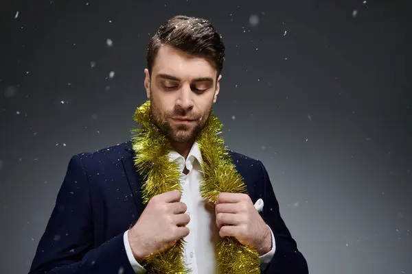 The young man celebrates winter joyfully, wearing a stylish outfit adorned with festive decorations. — Fotografia de Stock