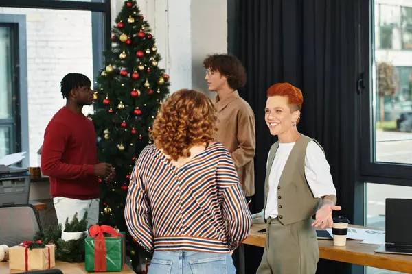 The team shares laughter and gifts while decorating for the holiday season. — Stock Photo