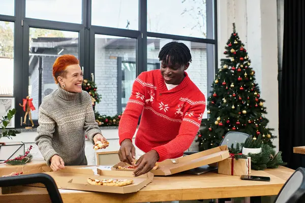 Co workers are sharing delicious food and laughter while celebrating the holiday season. — Stock Photo