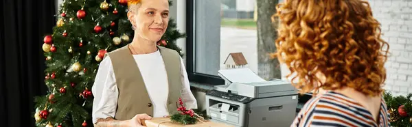 Colleagues exchange gifts and spread joy at their office Christmas celebration. — Stock Photo