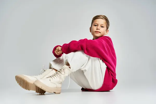 A young boy in warm winter clothing enjoys the seasons charm with cheerful expression. — Stock Photo