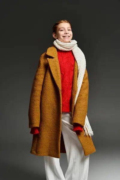 A young girl enjoys winter fashion in a warm, stylish outfit with a big smile. — Stock Photo