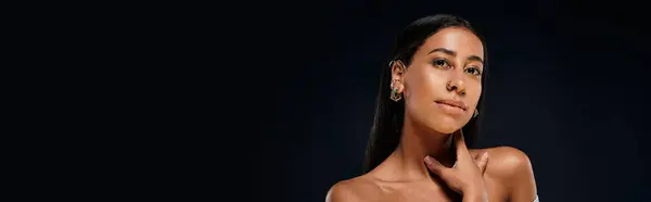 A beautiful African American woman showcases her jewellery in a studio with brunette hair. — Stock Photo