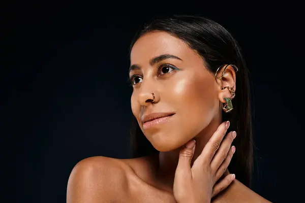 A stunning African American woman showcases her beauty in a studio environment. — Stock Photo