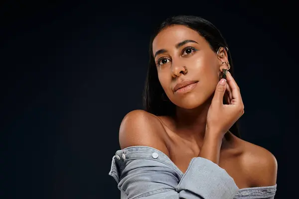 African American woman highlights her jewellery in a studio environment. — Stock Photo