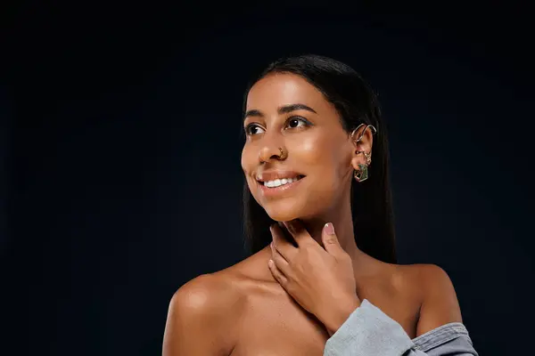 A woman highlights her beauty in a professional studio atmosphere. — Stock Photo