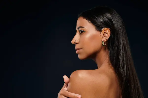 African American woman with brunette hair in a studio focused on skincare. — Stock Photo