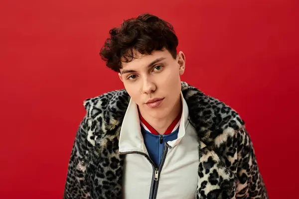 Handsome man dons a chic leopard print jacket, exuding confidence in a stylish urban setting. — Stock Photo
