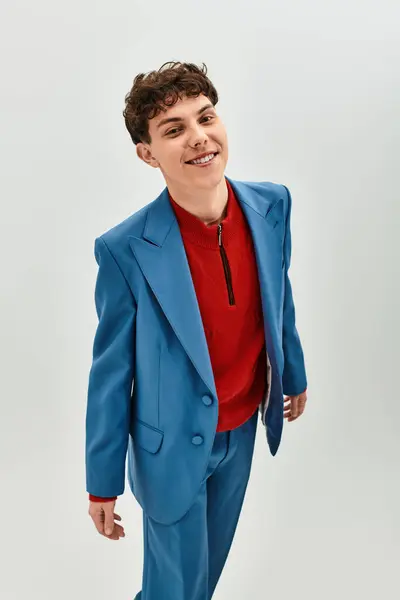 Handsome young man stands confidently in a modern space with stylish attire — Stock Photo