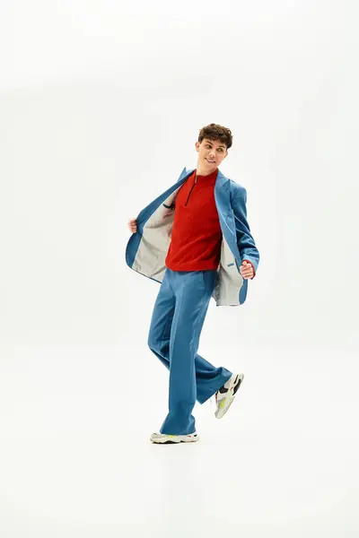 Charismatic person strikes a playful pose in a trendy outfit, radiating confidence. — Stock Photo