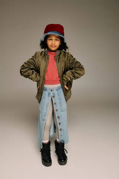 Smiling girl showcases unique winter fashion while celebrating joy in the holiday spirit — Stock Photo