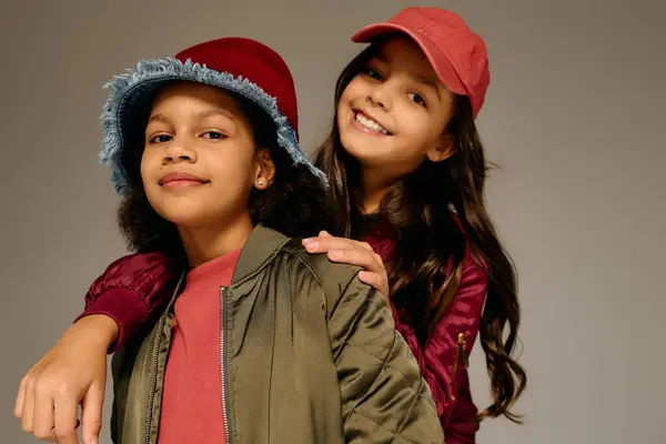 Two cheerful young girls pose together, embodying the joyful essence of Christmas 2025. — Stock Photo