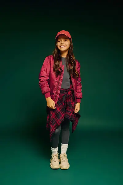 Girl in festive attire beams with joy, embodying the magic of Christmas 2025. — Stock Photo