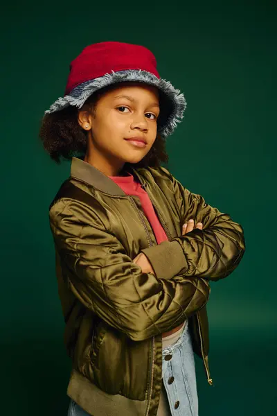 Little girl stands confidently in a festive outfit, capturing the spirit of Christmas 2025. — Stock Photo